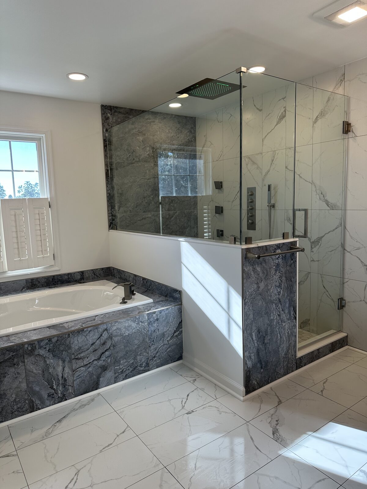 Luxury master bathroom with marble shower and soaking tub