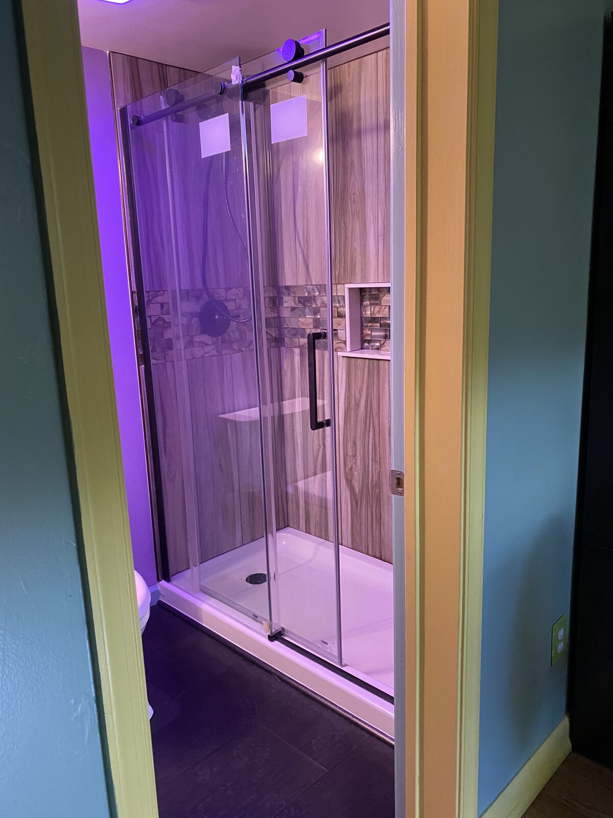 Picture frame molding wainscoting in foyer entryway